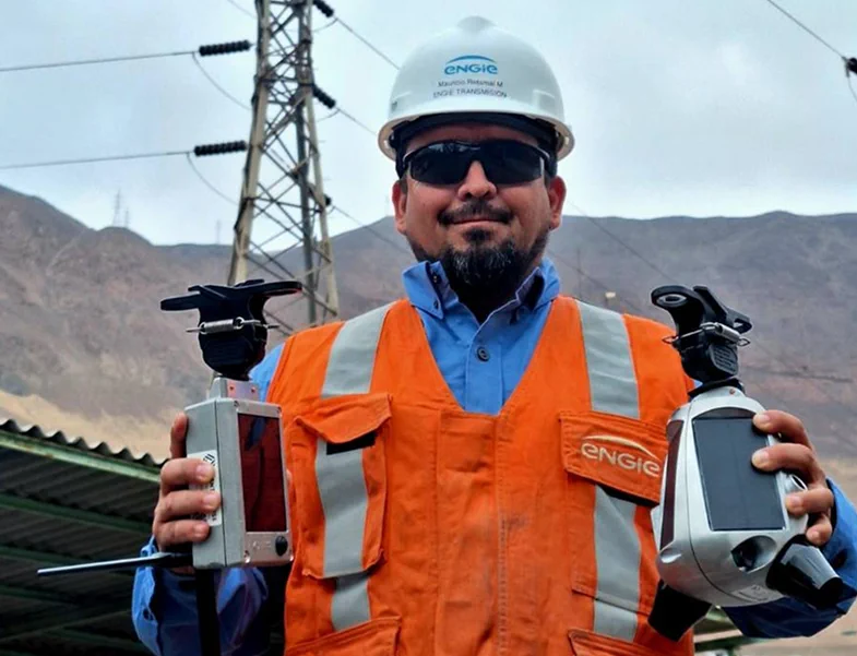 ENGIE technician holding SENTRI sensors on site