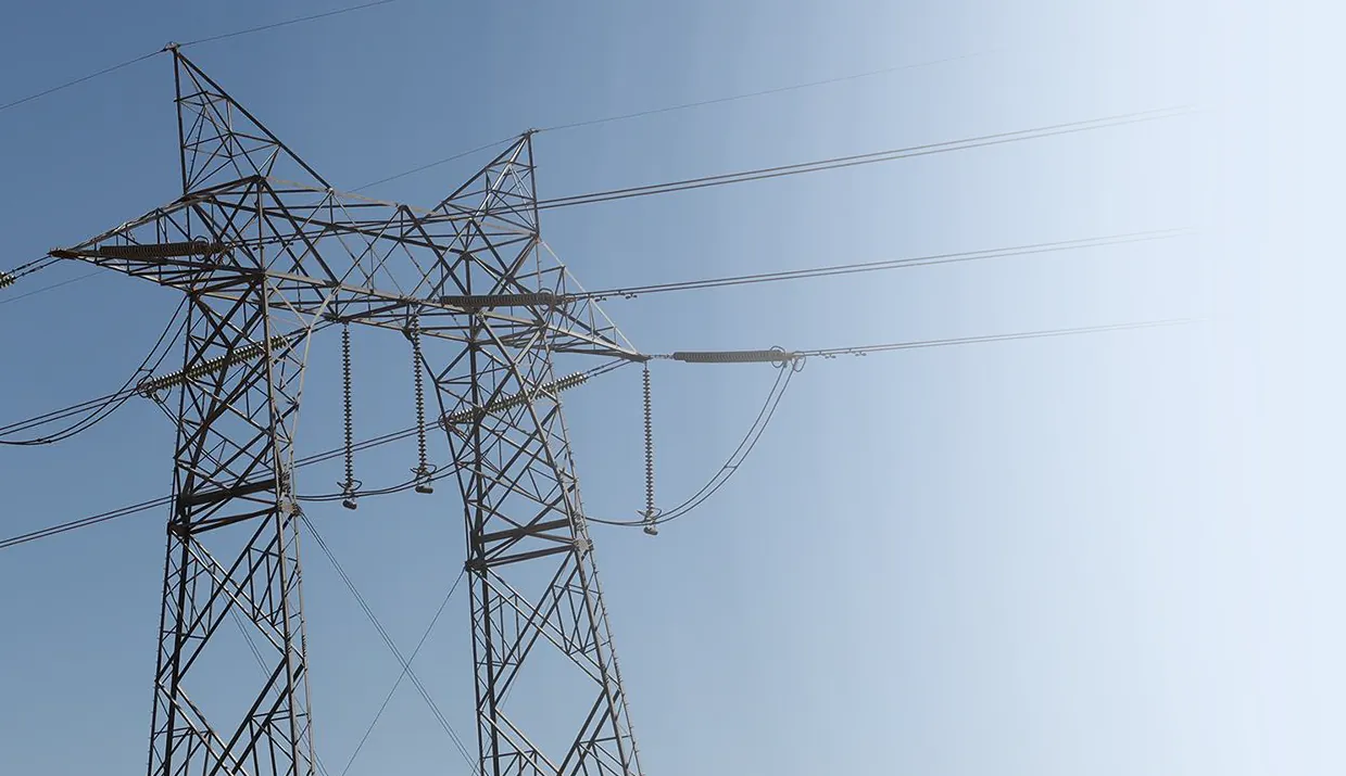Transmission tower against a blue sky